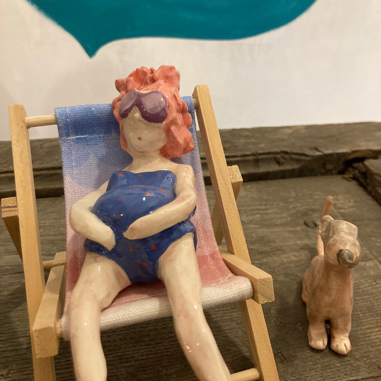 SEASIDE SERENITY: WOMAN WITH DOG SCULPTURE